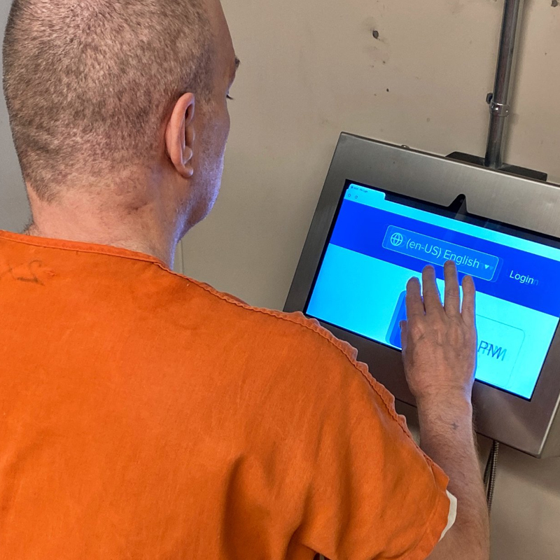 inmate using the video visitation device